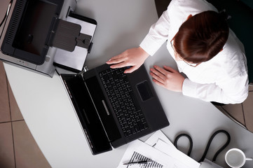 Young business woman working on a laptop