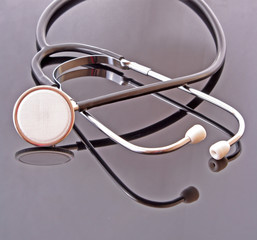 Medical doctor stethoscope on a black background