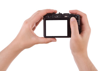 Hand photographing with a digital camera isolated on white