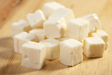 feta cheese on wooden cutting board