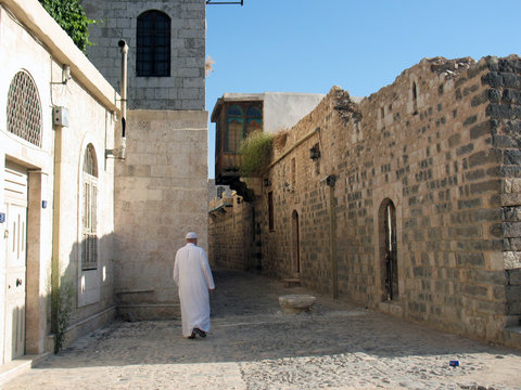 Syria,  Hama, downtown. Someone going to a mosque. From wordly v