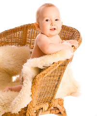 Smiling baby in armchair