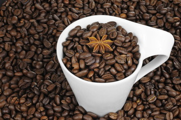 coffee beans, aniseed and a cup