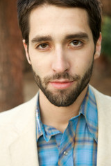 Fototapeta premium Attractive Young Man looking sternly at camera