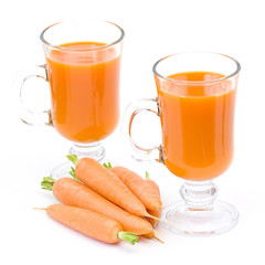 glass of fresh carrots juice and some fresh carrots
