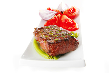 roast meat served with tomato