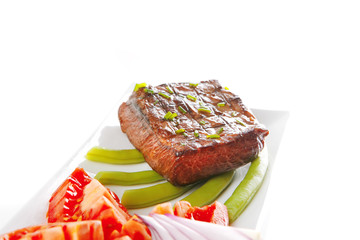 roast meat served with tomato