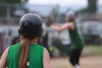 Teammate watching batter about to hit a pitch