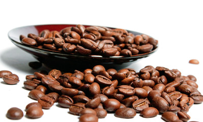 Coffee beans in a saucer.