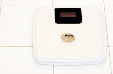 hope stone on bathroom scale