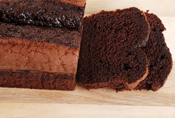 top view belgium chocolate cake loaf focus on slice