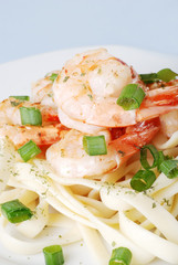top view shrimp with spring onions and noodles shallow dof