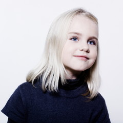 Naklejka premium studio portrait of a caucasian cute litle girl