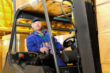 Naklejka premium forklift worker at warehouse