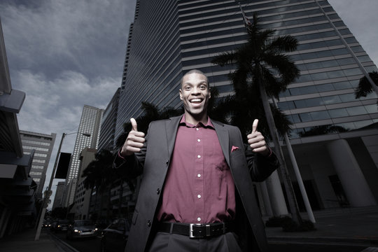 African American businessman showing thumbs-up