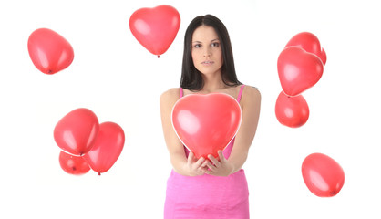Fototapeta na wymiar Beautiful young woman with red heart balloon
