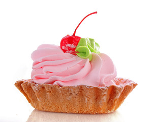 Pink cheesecake with maraschino cherry  on white