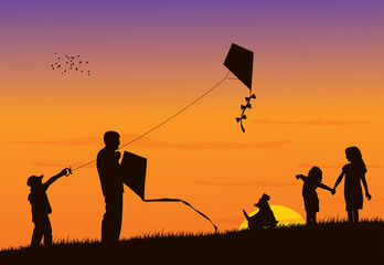 Fototapeta na wymiar Family flying kite