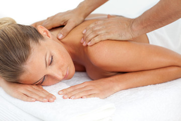 Fototapeta na wymiar Blond woman enjoying a massage