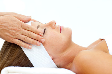 Asleep woman relaxing with head massage