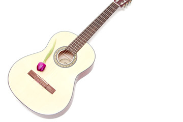 Fototapeta premium a yellow acoustic guitar isolated on white