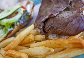 Sliced Lamb Sandwich and French Fries