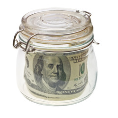 Money in the glass jar isolated on white