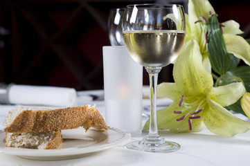 A la carte dinner setting with bread and wine
