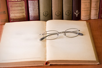 glasses and books in library