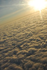 sky clouds with sun rays in  flight atmosphere