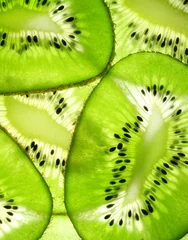 Papier Peint photo Tranches de fruits fond de kiwi