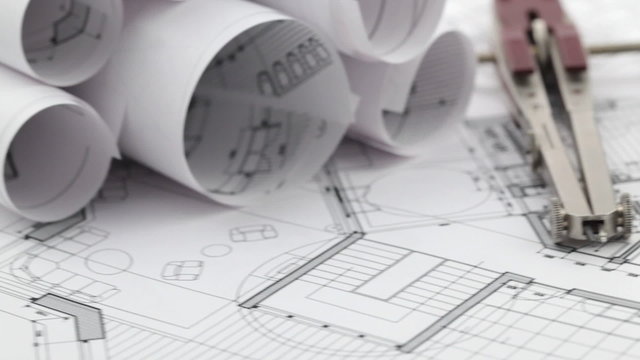 rolls of architectural drawings & work tools