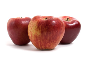 three fresh apples in a row