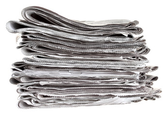 Pile of folded newspapers