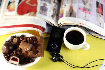 magazines, music player, sweets and coffee
