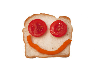 funny open sandwich of toast, tomato and some pepper