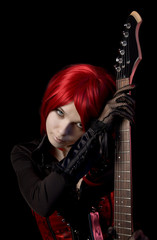 Obraz premium Sexy red haired girl with guitar