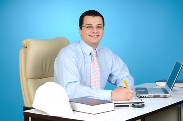 Obraz premium An engineer at work on blue background