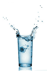 water splash in glass isolated on white