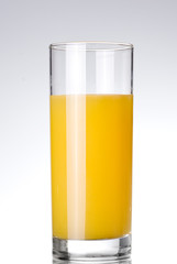 glass of orange juice on white