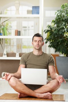 Meditation with laptop computer