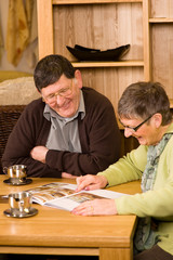 Fototapeta na wymiar Senior couple looking at brochure