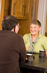 Senior couple together in kitchen