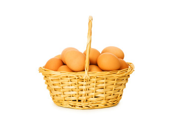 Basket full of eggs isolated on white