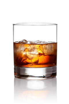 Glass of scotch whiskey and ice with clipping path
