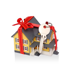 Gift house with red ribbon and key with clipping path