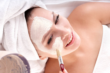 Cosmetician make mask. Facial massage.