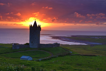sunset of a ancient castle in the west coast of ireland