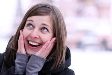 Laughing beautiful girl snowboarder