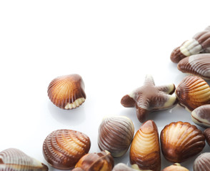 Chocolate Seashells border.Isolated on white